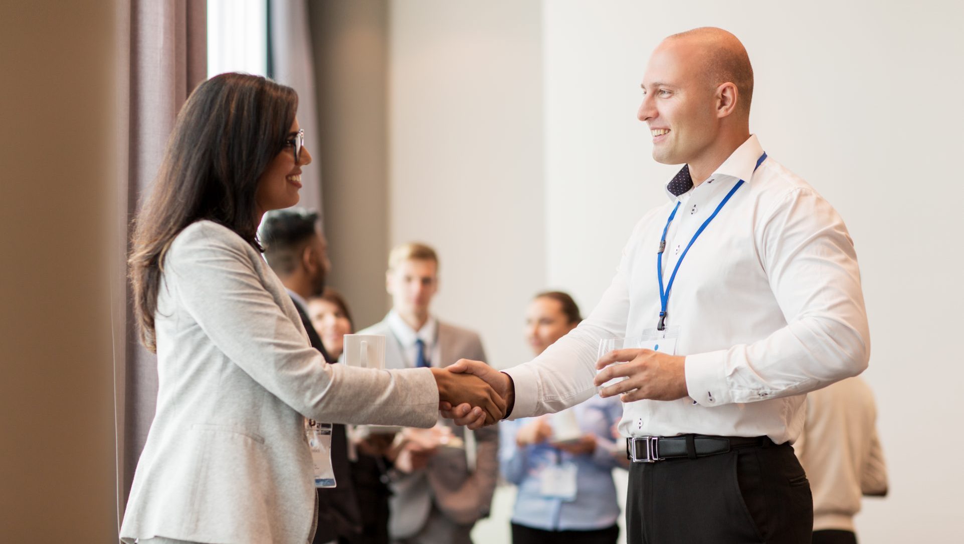 handshake of people at business conference