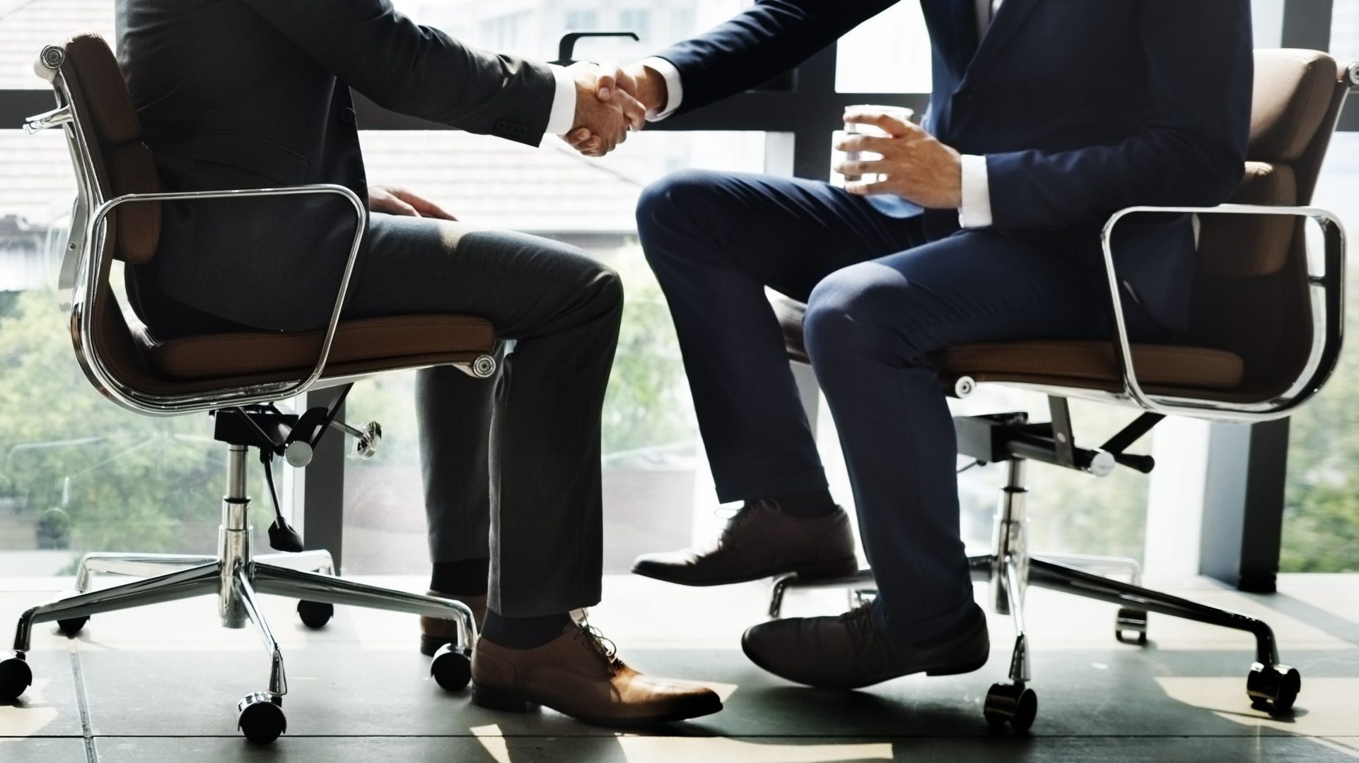 businessmen-handshake-office-concept-P9K9H4W-min