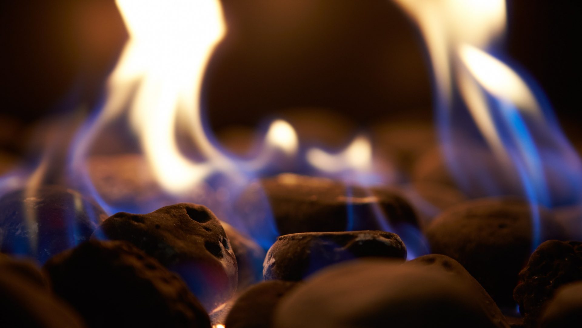close-up-of-flaming-coals-on-gas-fire-PHKFLVF-min