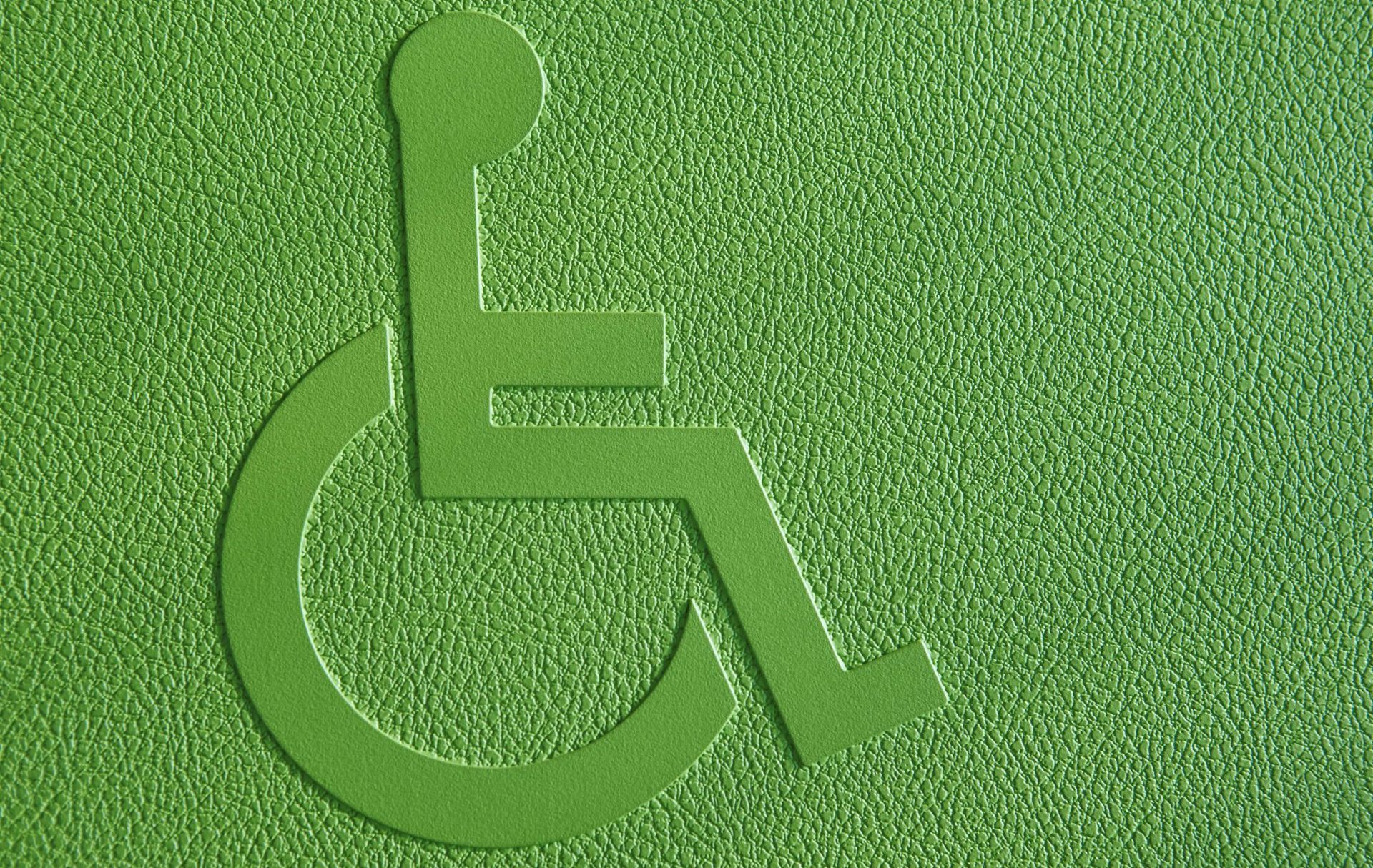 disabled-symbol-on-a-green-textured-background-PRRLPLM-min