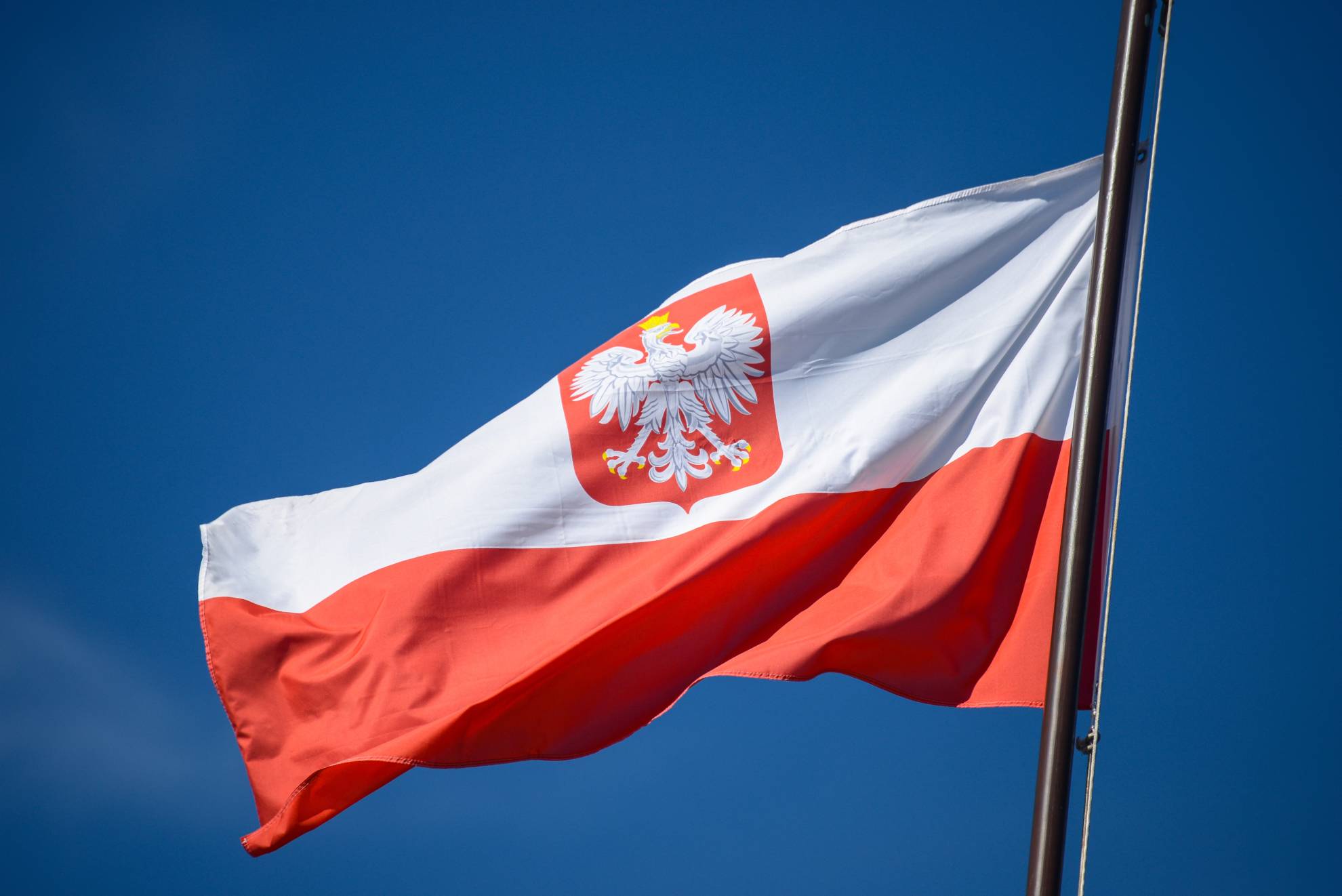 the-state-flag-of-poland-with-the-emblem-of-the-re-2021-11-09-20-04-23-utc (1)