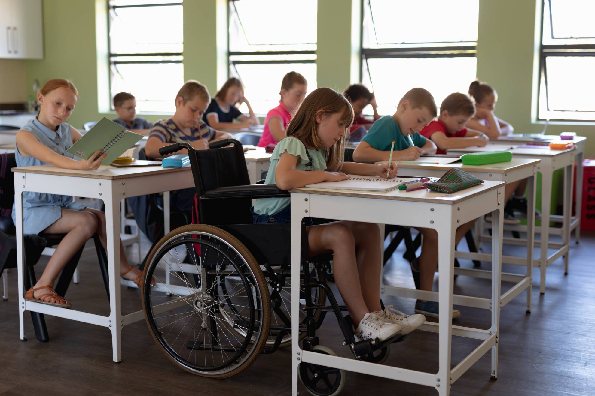 group-of-schoolchildren-sitting-at-desks-in-an-ele-2021-08-28-16-48-04-utc (1)