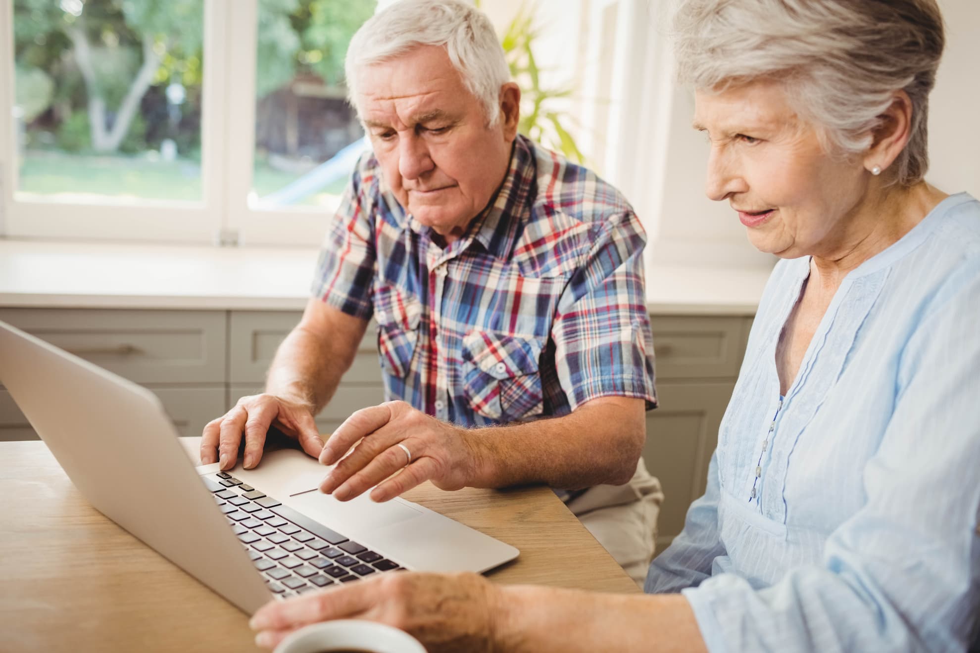 senior-couple-checking-their-bills-at-home-2021-08-28-16-43-27-utc