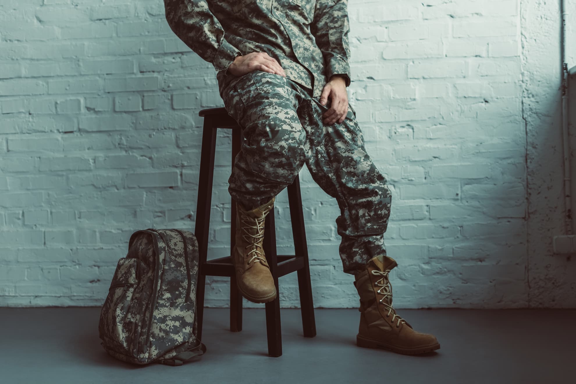 partial-view-of-soldier-in-military-uniform-sittin-2021-08-29-21-23-58-utc