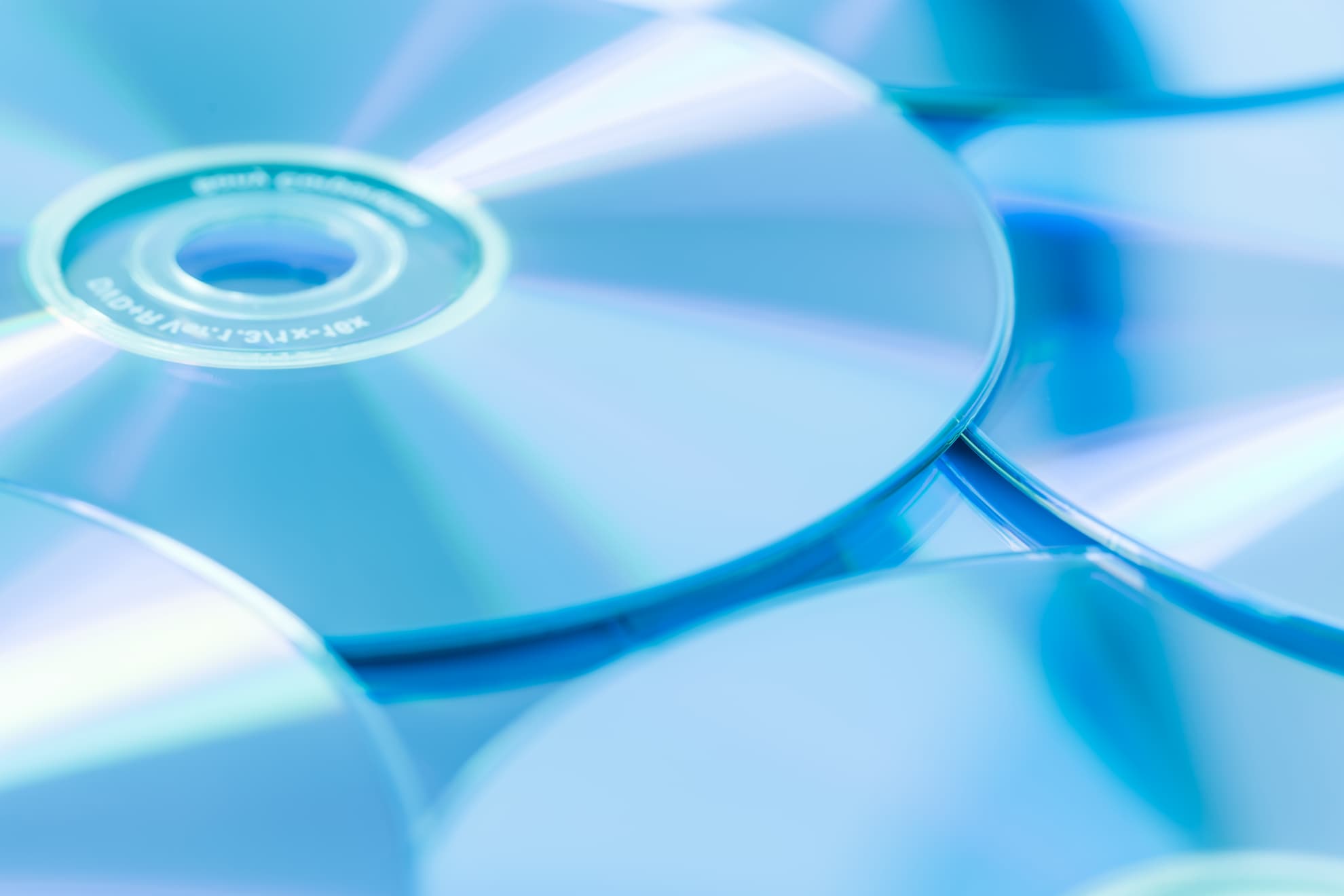 stack-of-cd-or-dvd-in-blue-tone-as-background-sof-2021-08-28-03-25-29-utc