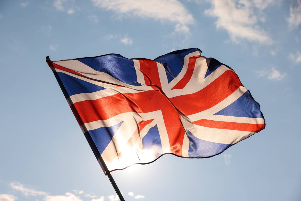 uk-great-britain-flag-waving-in-cloudy-blue-sky-2023-11-27-05-23-04-utc (1) (1)
