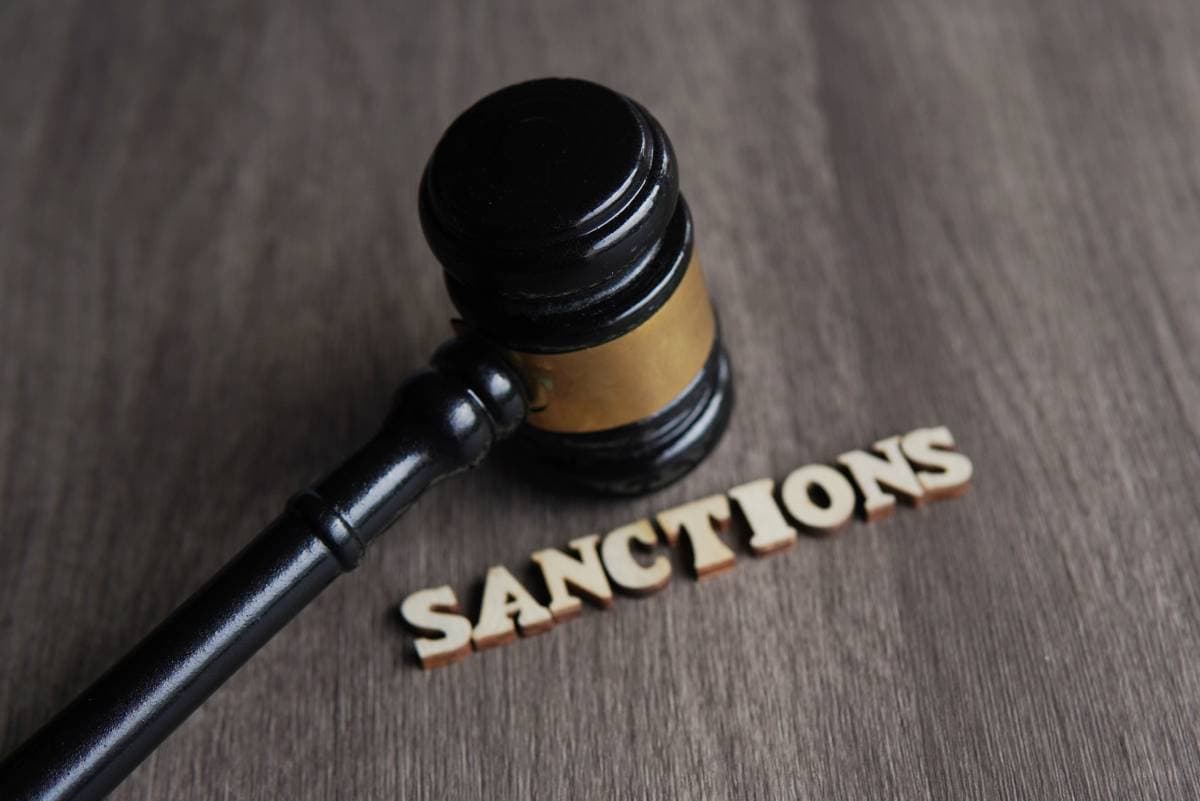 close-up-image-of-judge-gavel-and-text-sanctions-2023-12-15-19-04-15-utc (1)