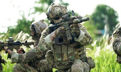 Infantry soldier shooting during military combat training.