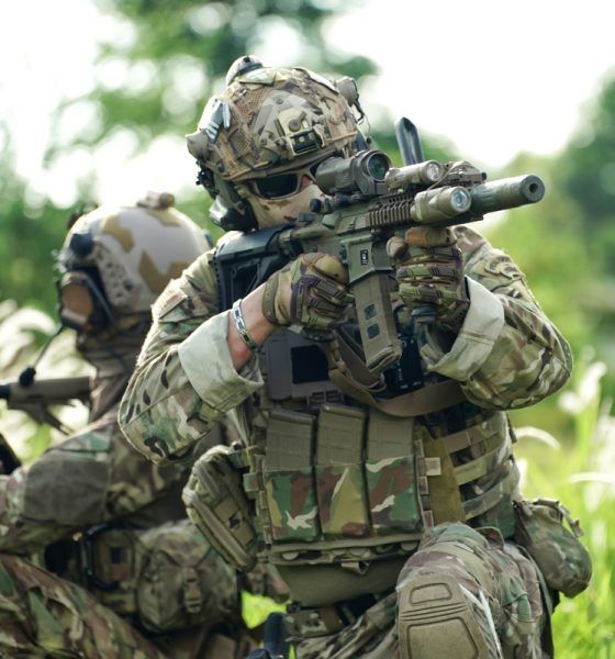 Infantry soldier shooting during military combat training.