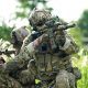 Infantry soldier shooting during military combat training.